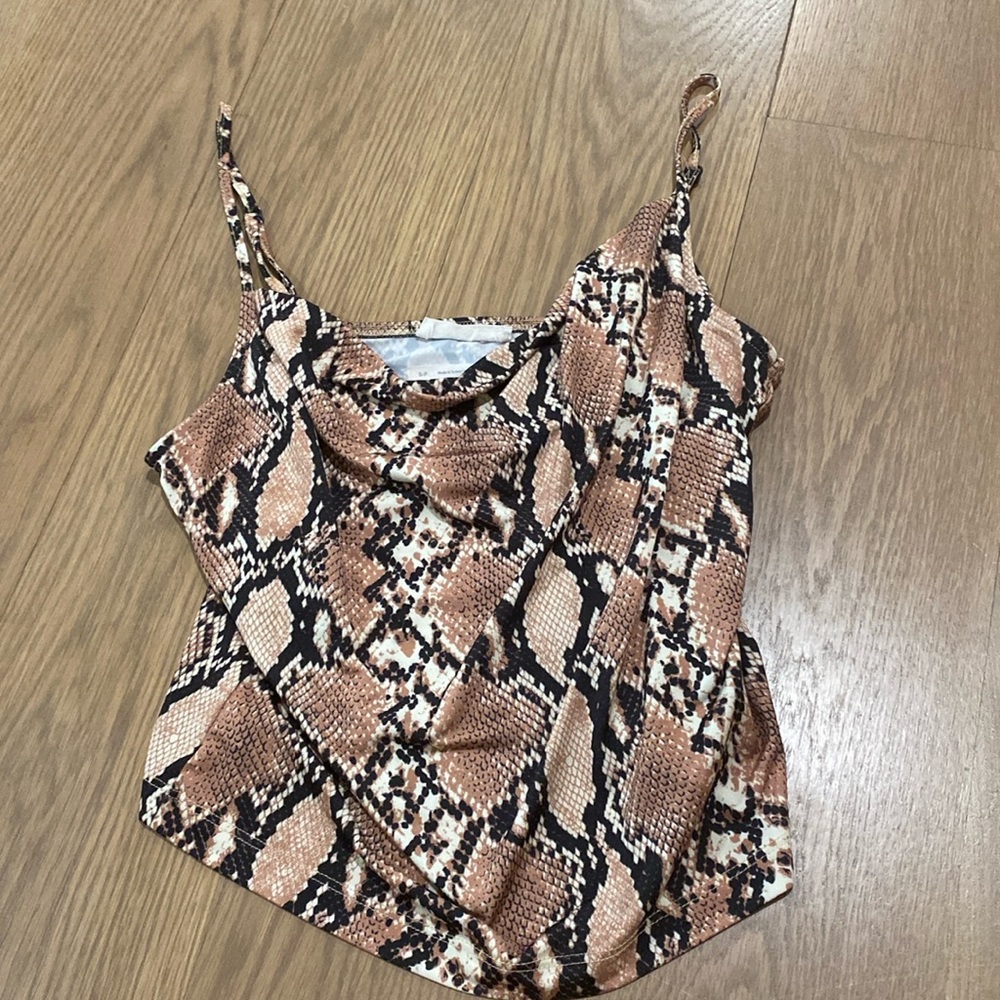 Snake print going out top with cowbell neckline